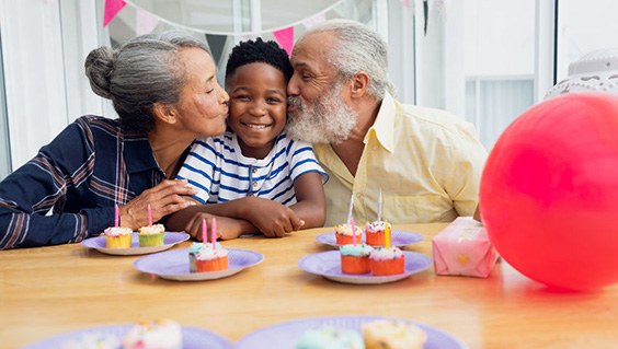 Retired couple at their grandson's birthday